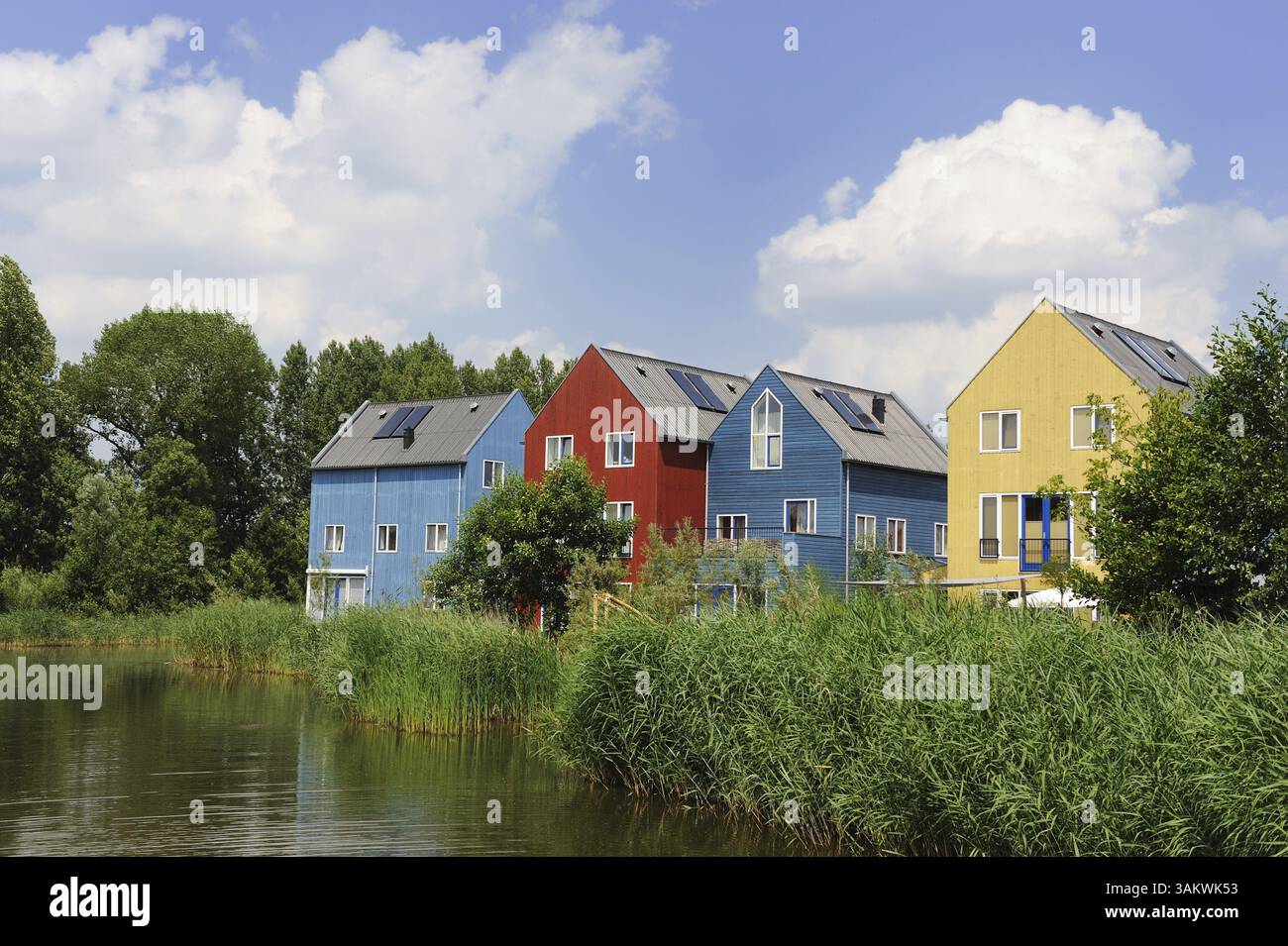 Energy saving houses with solar cells on the roof Stock Photo