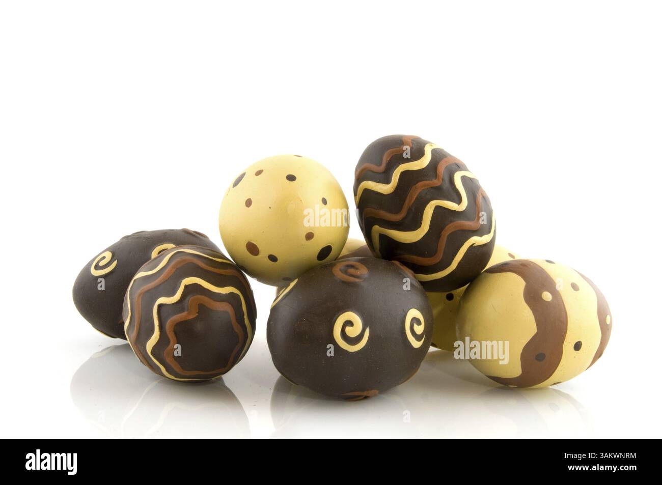 Chocolate easter eggs in different patterns isolated over white Stock Photo