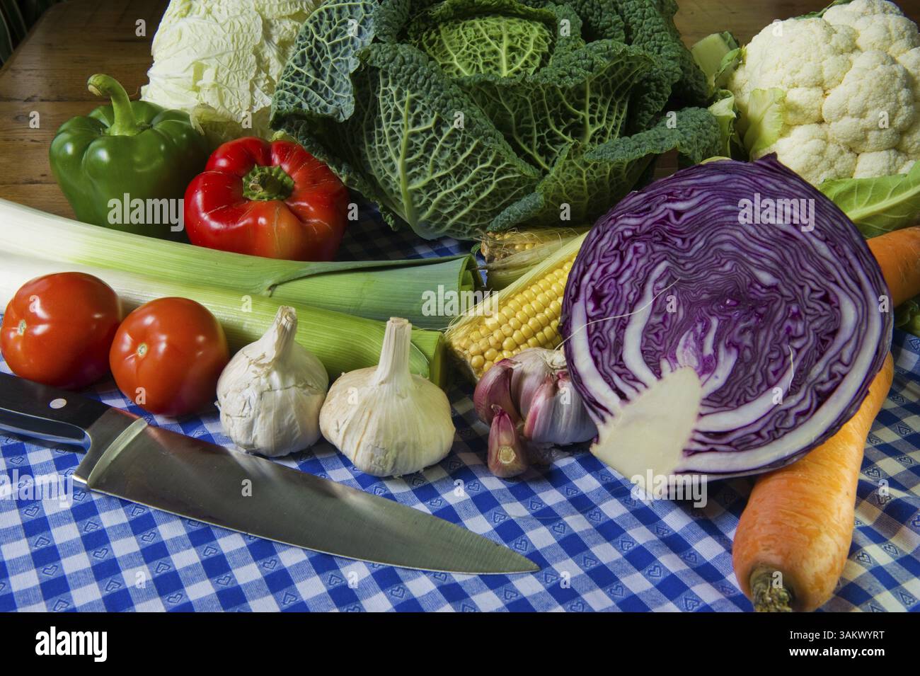 Still life with assortment cabbages on wooden table Stock Photo