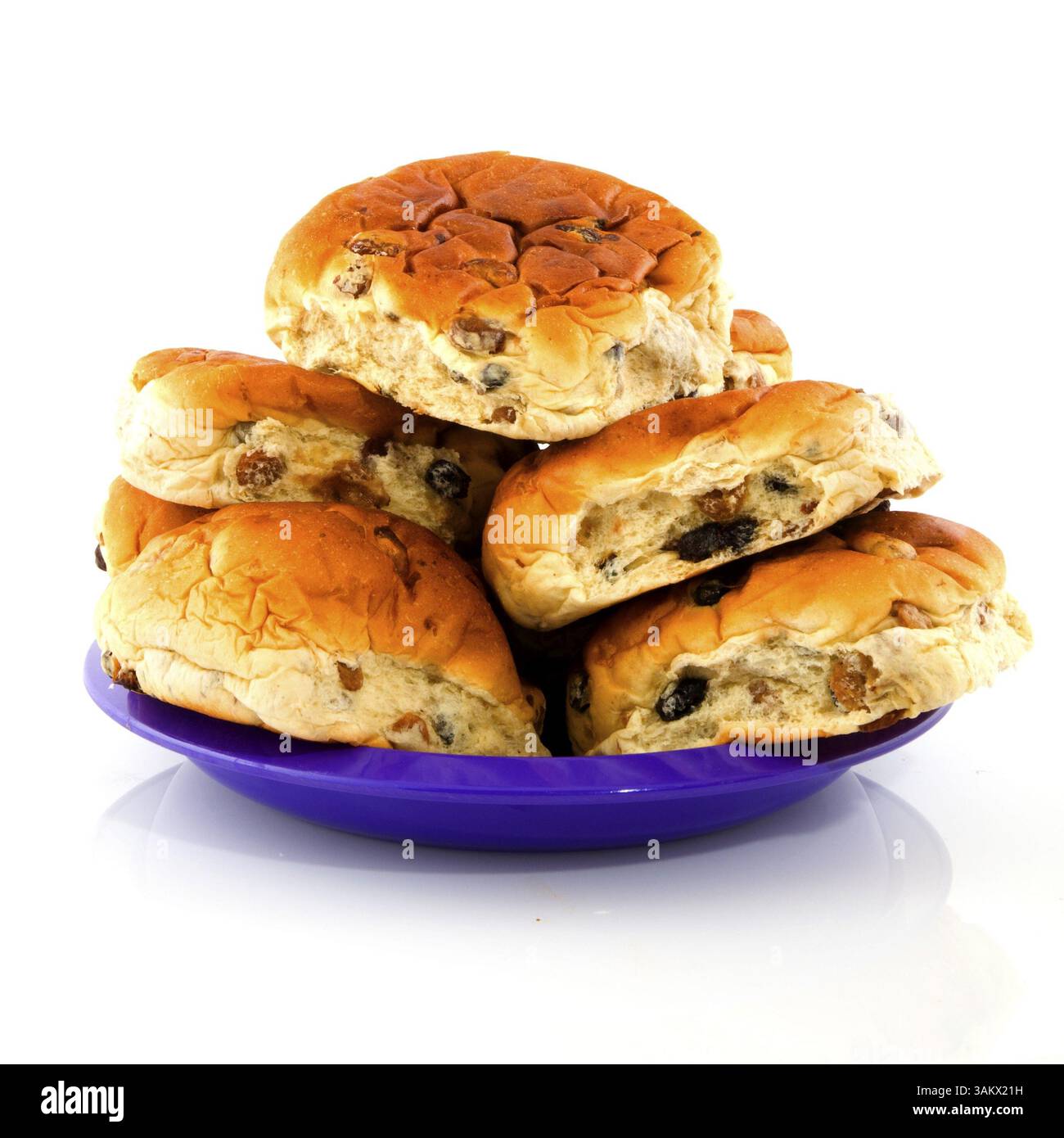 Currant bread rolls stacked on a purple plate Stock Photo