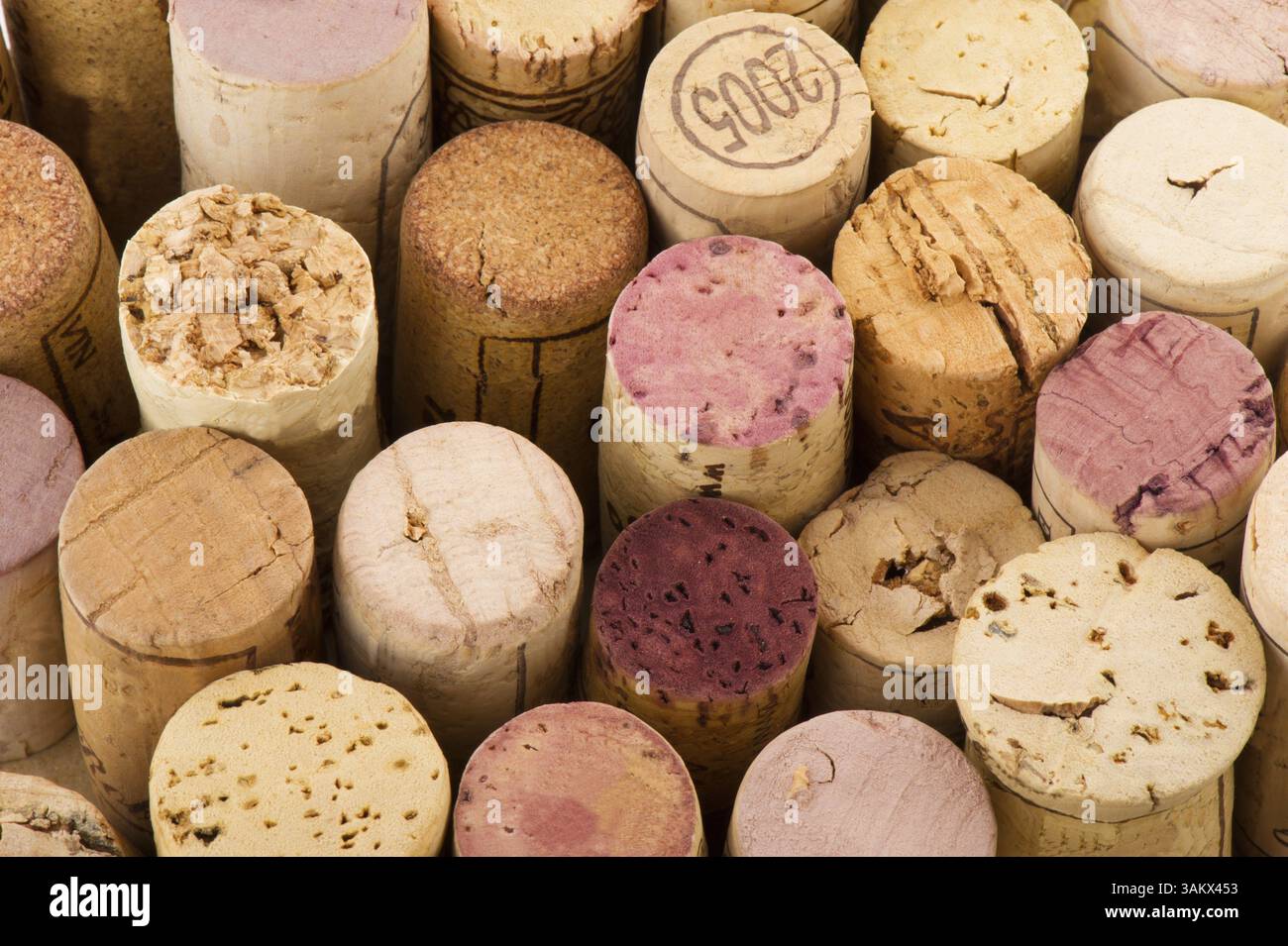 Many used corks from wine bottles in different sizes Stock Photo