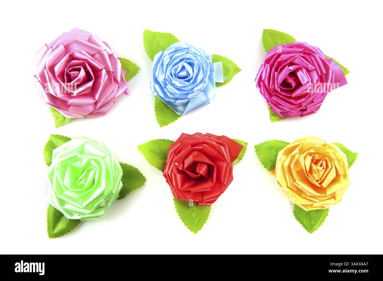 Chinese silk roses in a pattern isolated over white Stock Photo - Alamy