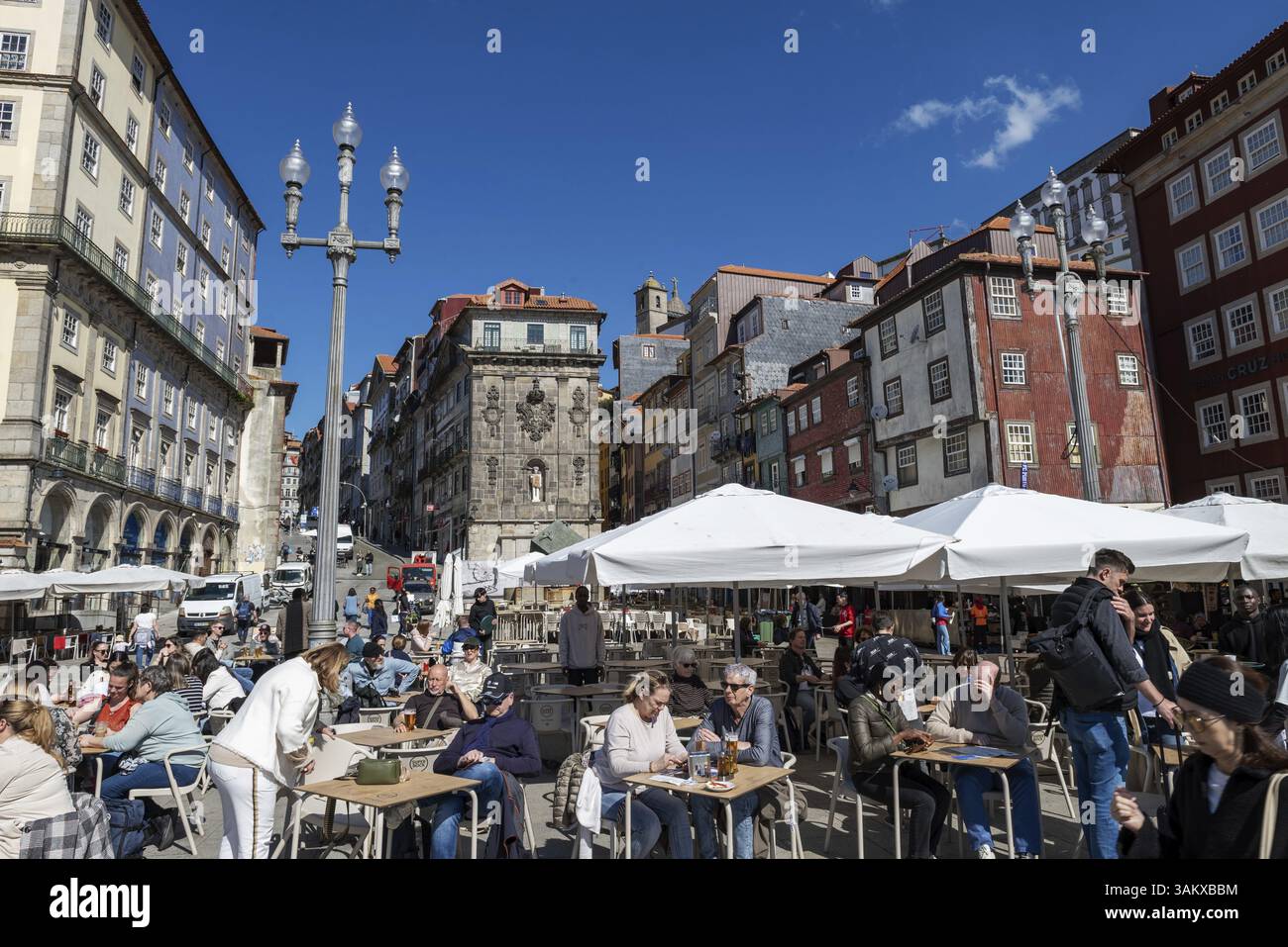 Lively waterfront promenade Cais da Ribeira. with a busy street cafe in the city of Porto, Portugal, Europe Stock Photo