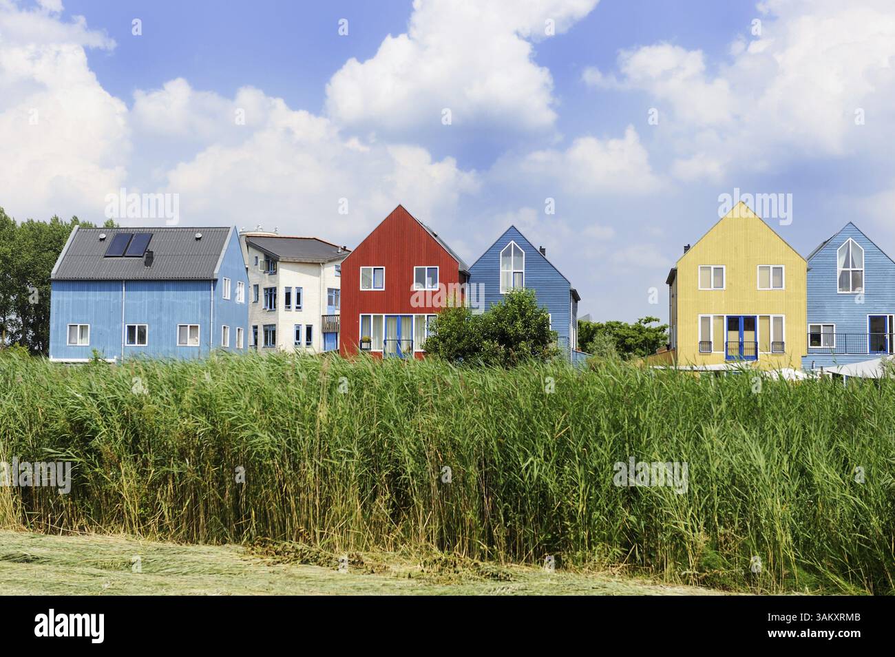 Energy saving houses with solar cells on the roof Stock Photo