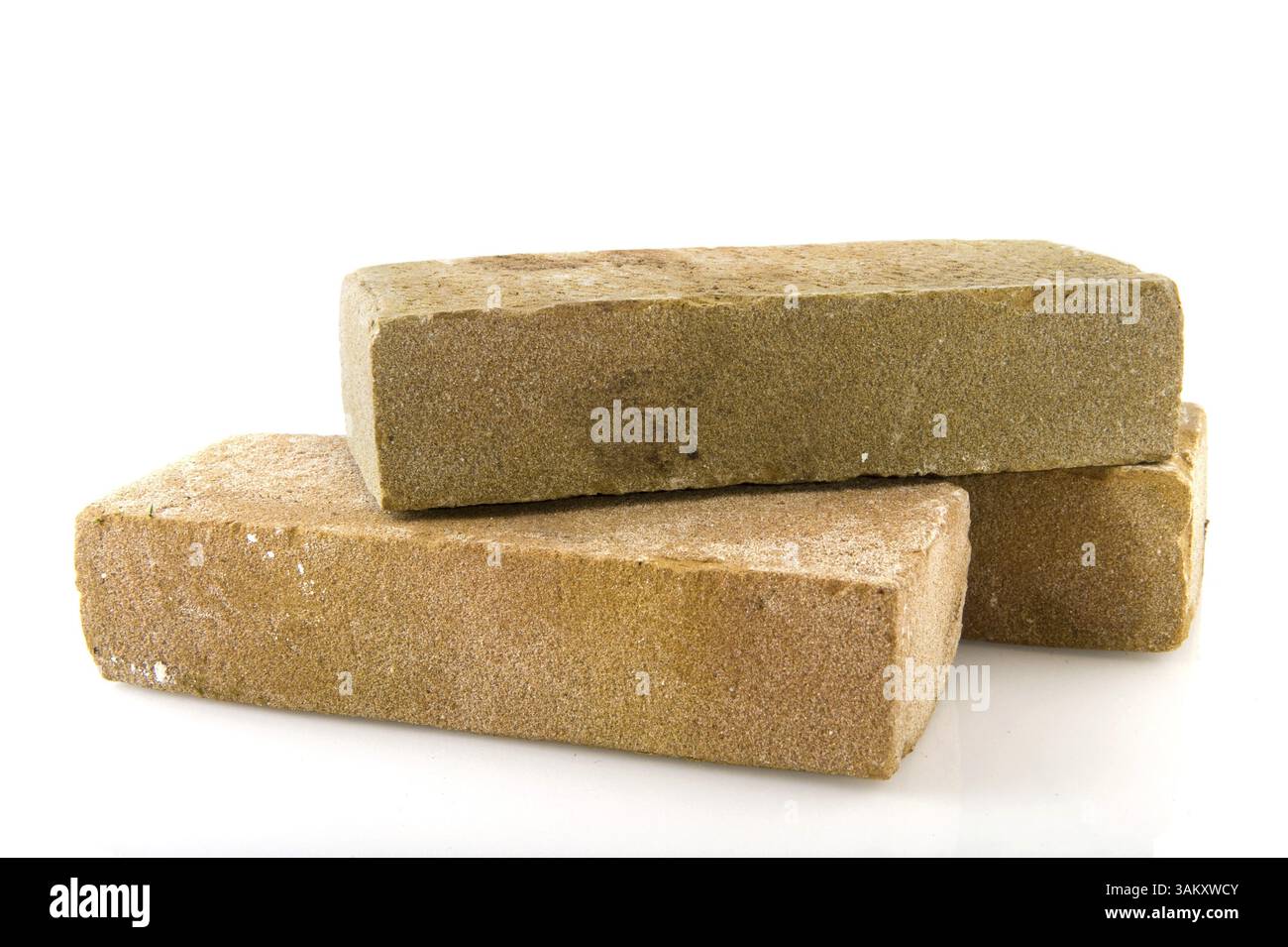 Three bricks stacked and isolated over white Stock Photo