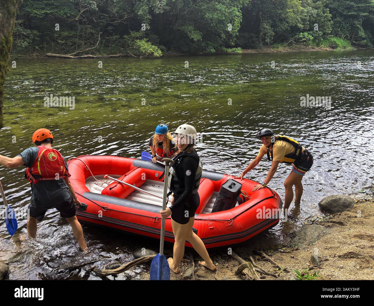 Excited whitewater rafters setting out on the Mulgrave River, Wooroonooran National Park, Wet Tropics, near Cairns, Queensland, Australia. No MR or PR - Smartphone Captured Stock Image