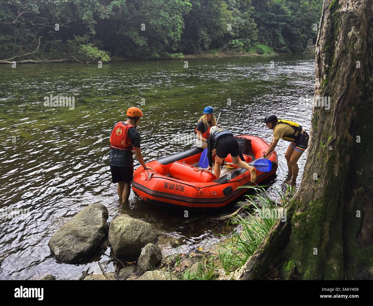 Excited whitewater rafters setting out on the Mulgrave River, Wooroonooran National Park, Wet Tropics, near Cairns, Queensland, Australia. No MR or PR - Smartphone Captured Stock Image
