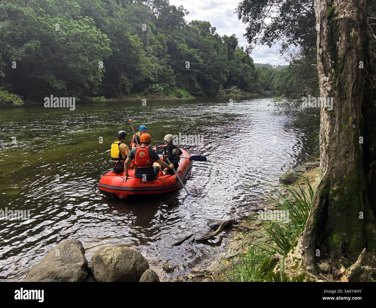 Excited whitewater rafters setting out on the Mulgrave River, Wooroonooran National Park, Wet Tropics, near Cairns, Queensland, Australia. No MR or PR - Smartphone Captured Stock Image