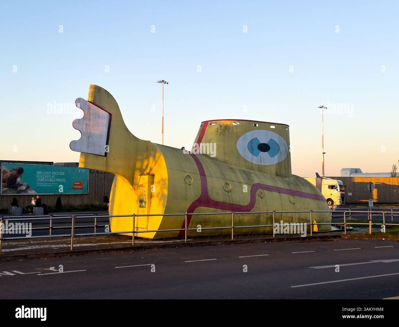 Life size sculpture of the Yellow Submarine  at John Lennon Airport. Liverpool, Merseyside, - Smartphone Captured Stock Image