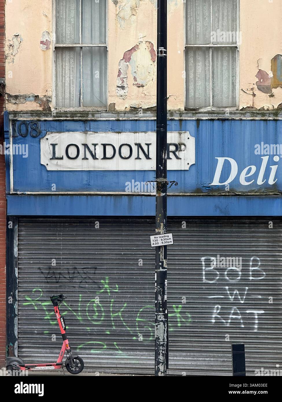 Shuttered deli shop on London Road, Liverpool with electric scooter - Smartphone Captured Stock Image