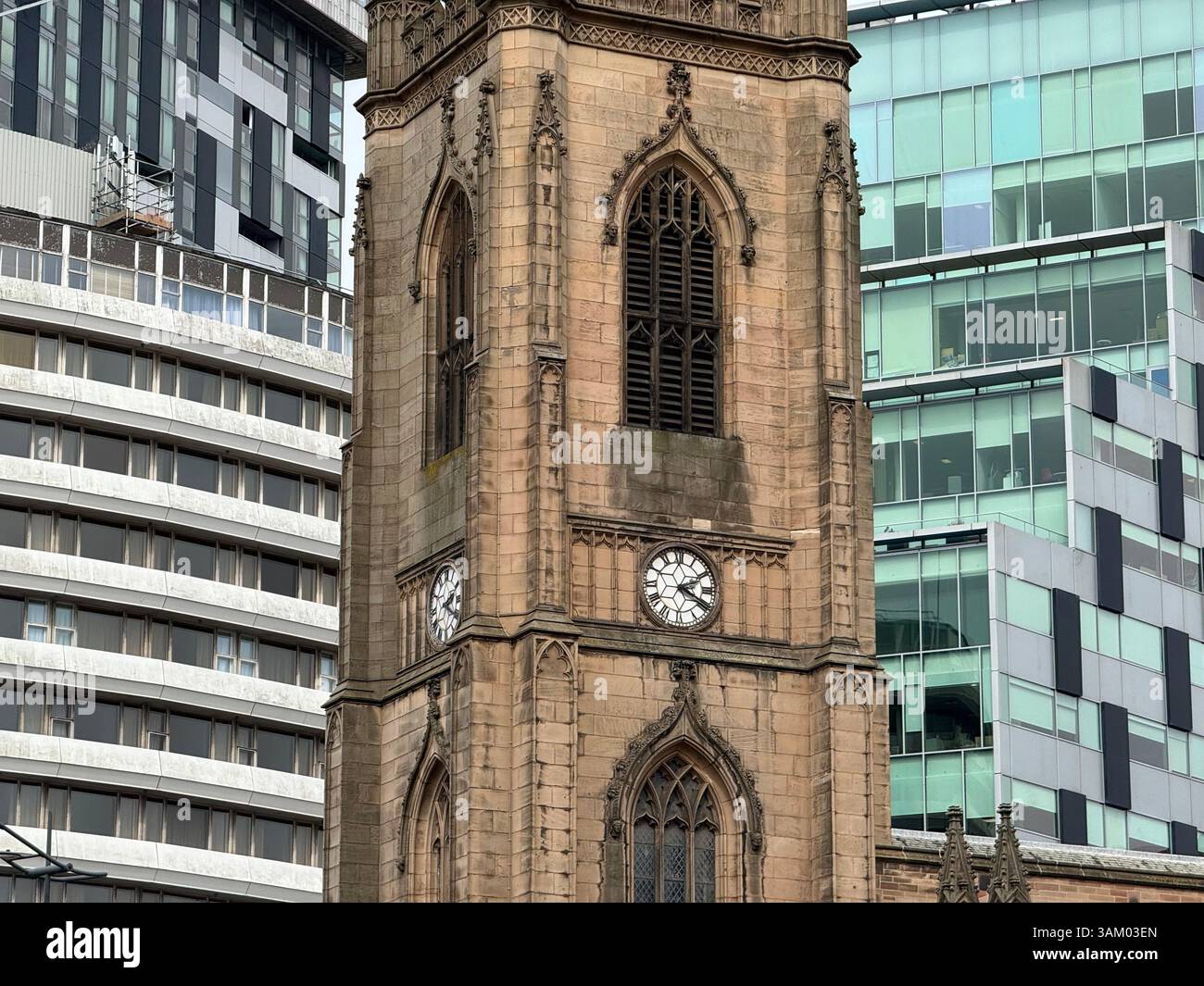 The Church of Our Lady and Saint Nicholas is the Anglican parish church of Liverpool with modern buildings in background - Smartphone Captured Stock Image