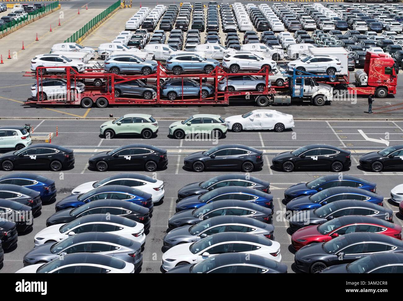New cars wait for shipment at a ro-ro pier in Shanghai, China Sunday ...