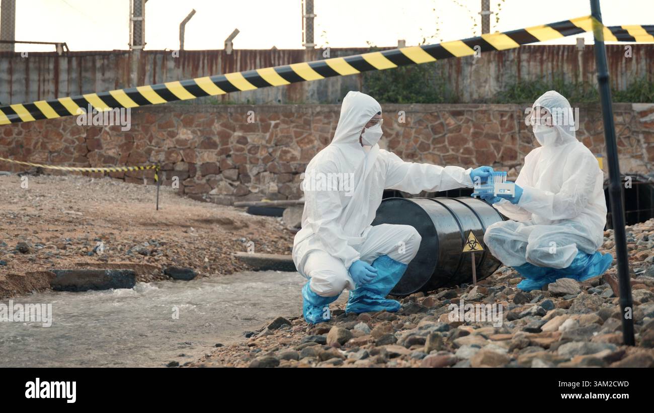 Ecologist sampling water from the river with test tube Stock Photo - Alamy
