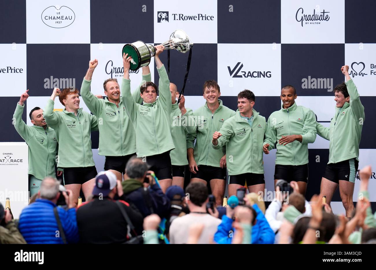 Cambridge men's team president Luca Ferraro celebrates with the trophy ...