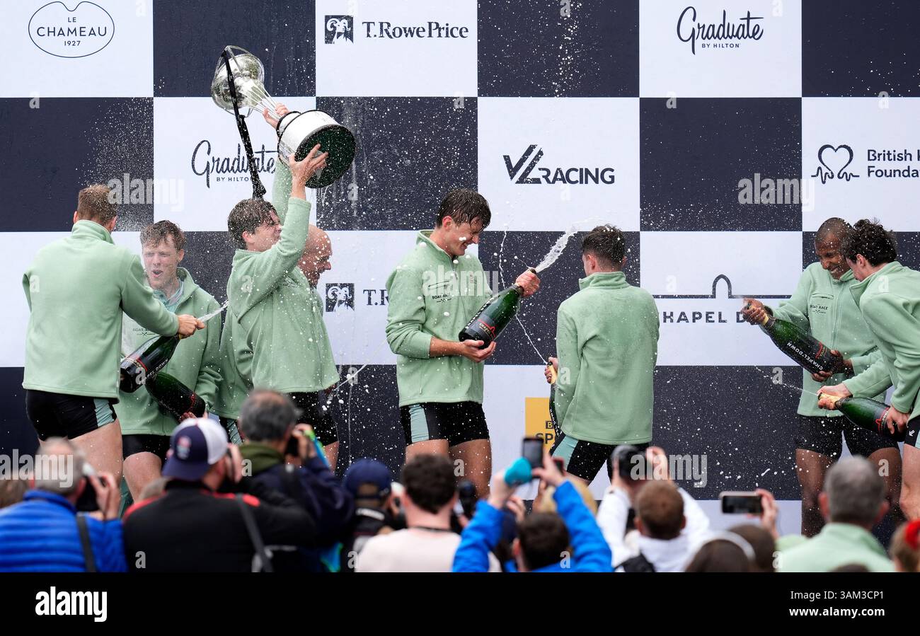 Cambridge men's team president Luca Ferraro celebrates with the trophy ...