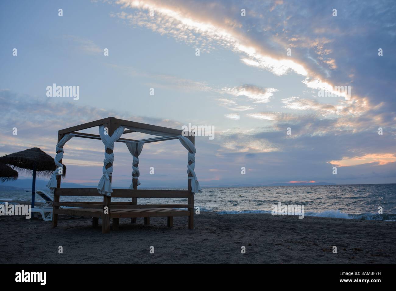 sunrise with a bed on the beach. Spain. Almeria Stock Photo