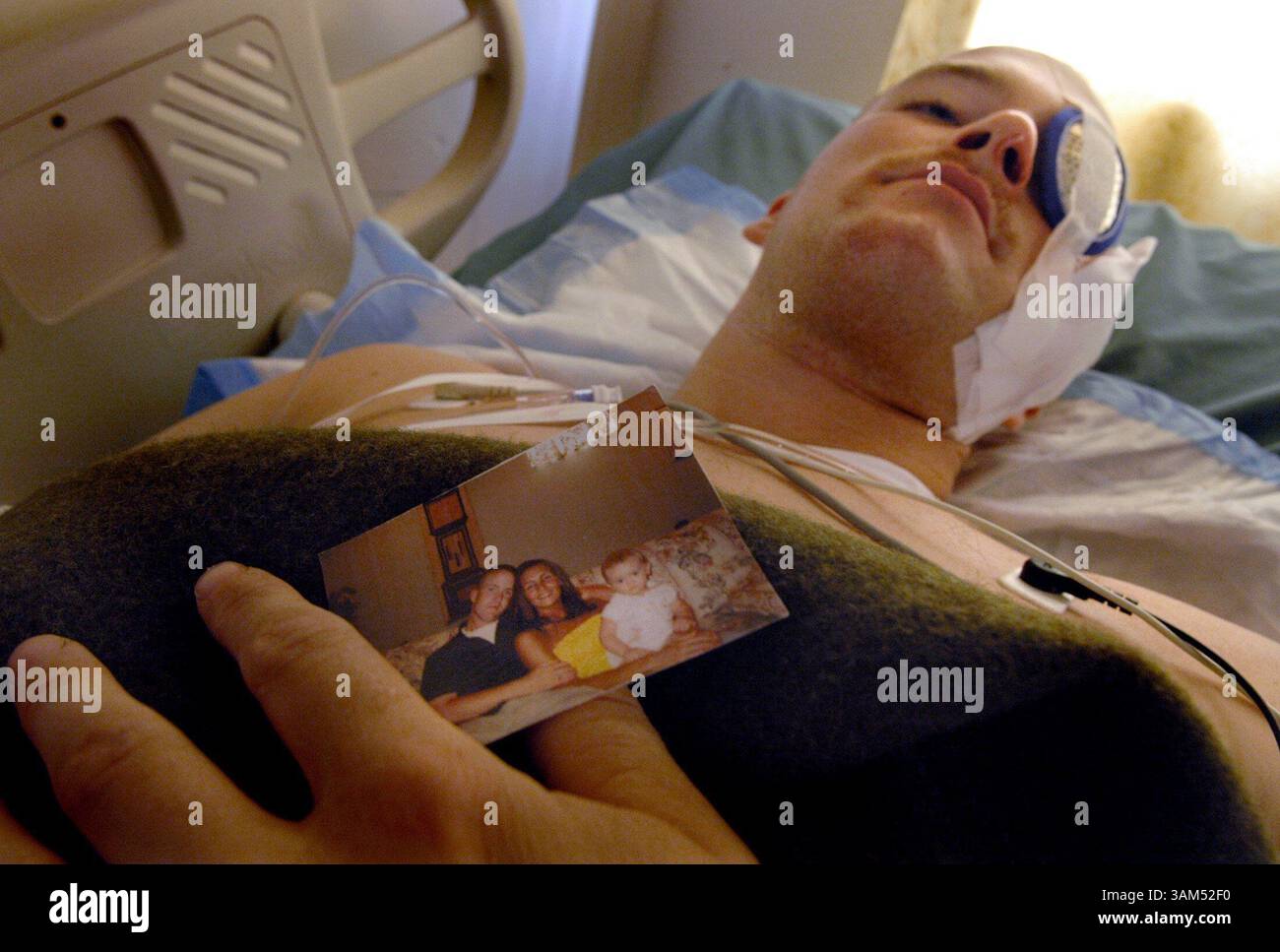 Oct. 13, 2004 - U.S. - KRT WORLD NEWS STORY SLUGGED: MED-USIRAQ-WOUNDED KRT PHOTO BY KUNI TAKAHASHI/CHICAGO TRIBUNE (October 28) U.S. Marine Cpl. Donny Daughenbaugh lays in a bed at the 31st Combat Support Hospital in Baghdad, Iraq, on October 13, 2004, recovering from wounds he received when he was shot on patrol. (gsb) 2004 (Credit Image: © Kuni Takahashi/mct/ZUMAPRESS.com) Stock Photo