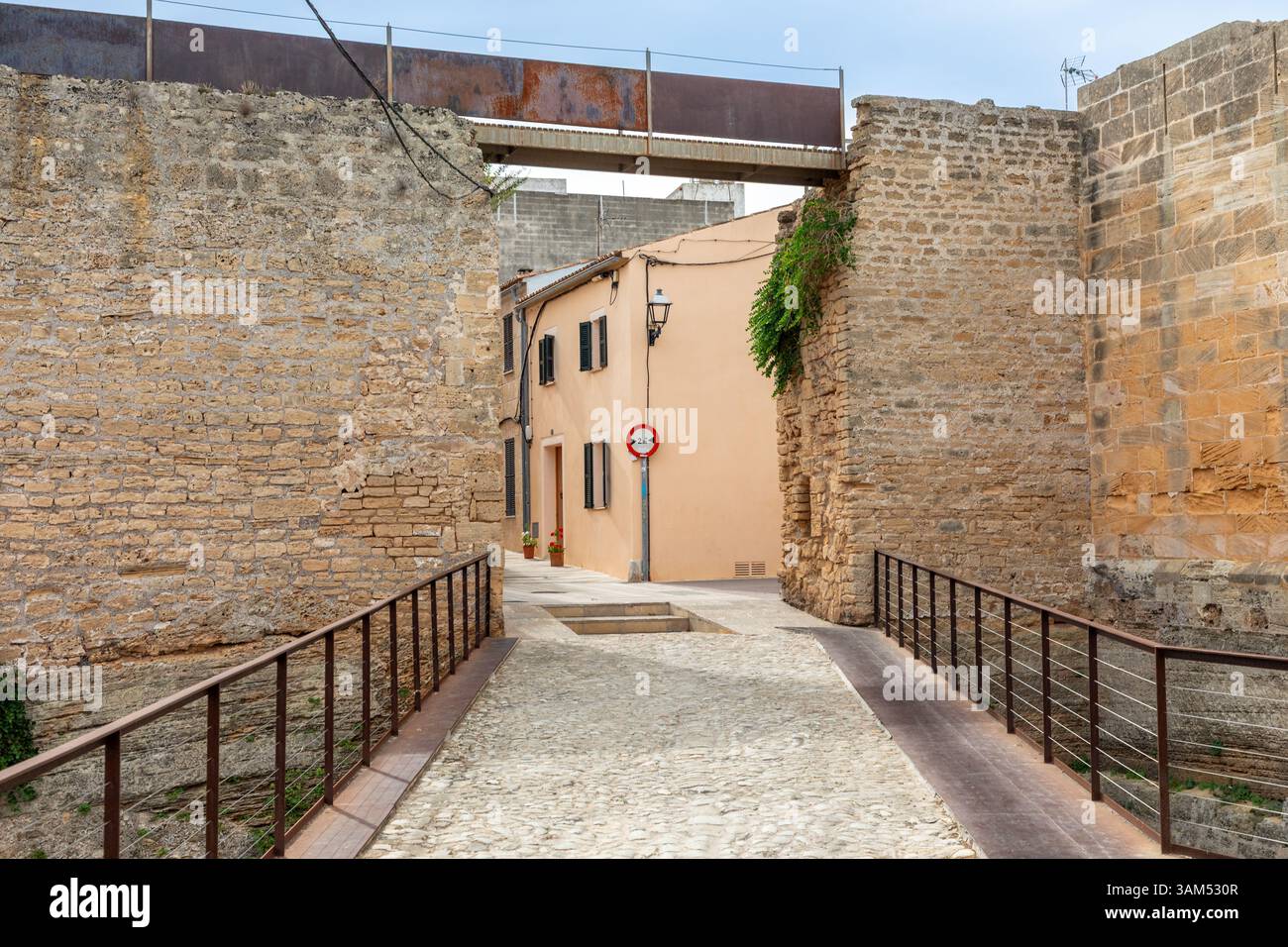 Gate in the city wall of Alcudia, Island of Mallorca, Spain Stock Photo