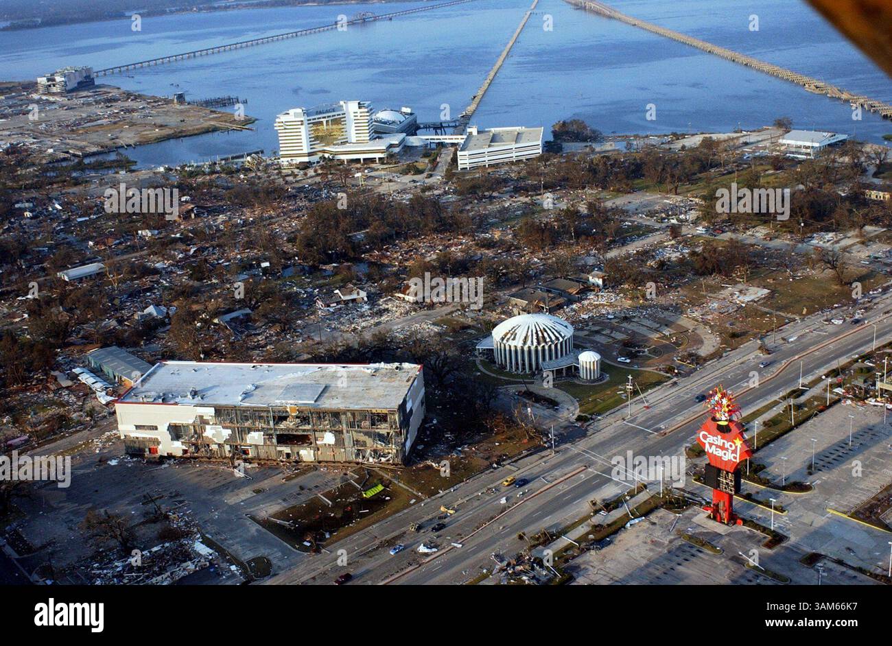 Aug. 30, 2005 - U.S. - KRT US NEWS STORY SLUGGED: WEA-KATRINA KRT PHOTOGRAPH BY DAVID PURDY/BILOXI SUN HERALD (August 31) The Casion Magic Biloxi barge rests on the north side of U.S. 90 in Biloxi, Mississippi, next to the St. Michaels Catholic Church by the Sea, August 30, 2005. The Oceans Springs bridge, pictured top right, suffered heavy damage along with the Palace Casino, pictured top center, from Hurricane Katrina that made landfall on the Mississippi Gulf Coast on Monday, August 29, 2005. (lde) 2005 (Credit Image: © David Purdy/mct/ZUMAPRESS.com) Stock Photo