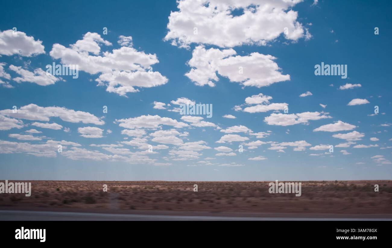 Sky with white clouds and deep blue sky above the desert in Uzbekistan ...