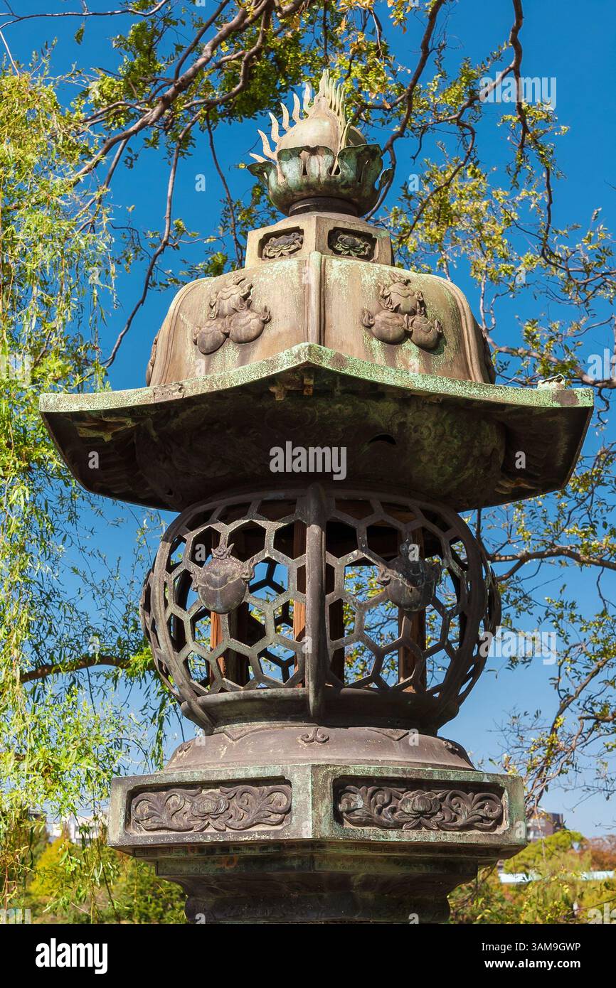 Old traditional japanese bronze lantern, a type often find near temple and shrines Stock Photo
