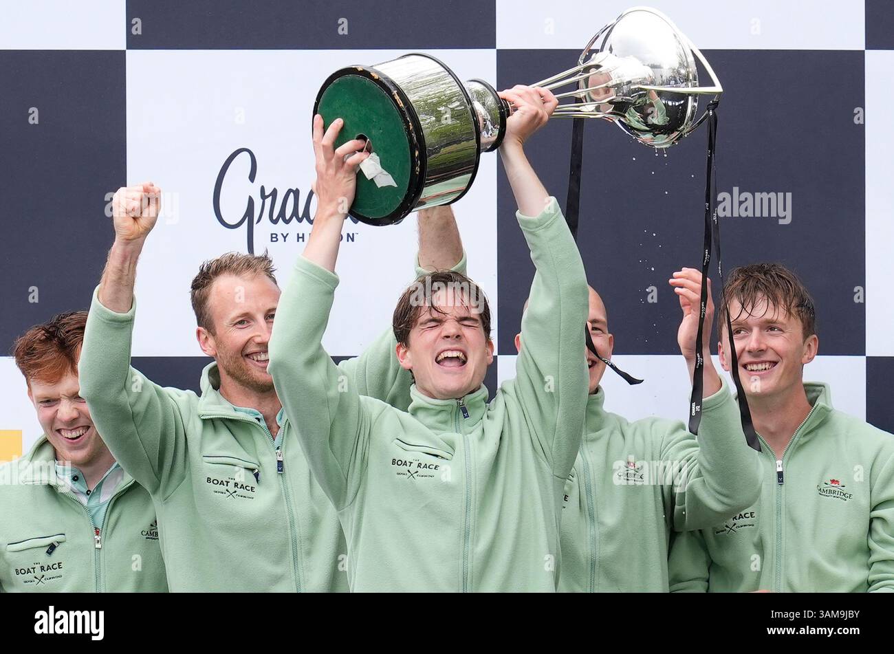 Cambridge Men's team president Luca Ferraro celebrates with the trophy ...
