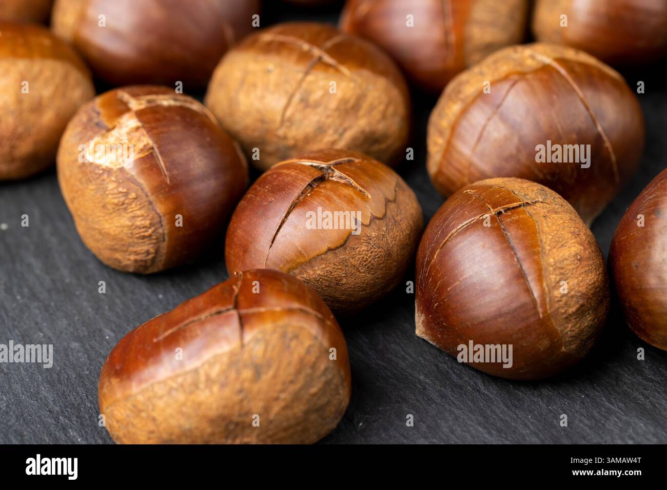 a cross incised on a chestnut shell, cutting the shells of edible ...