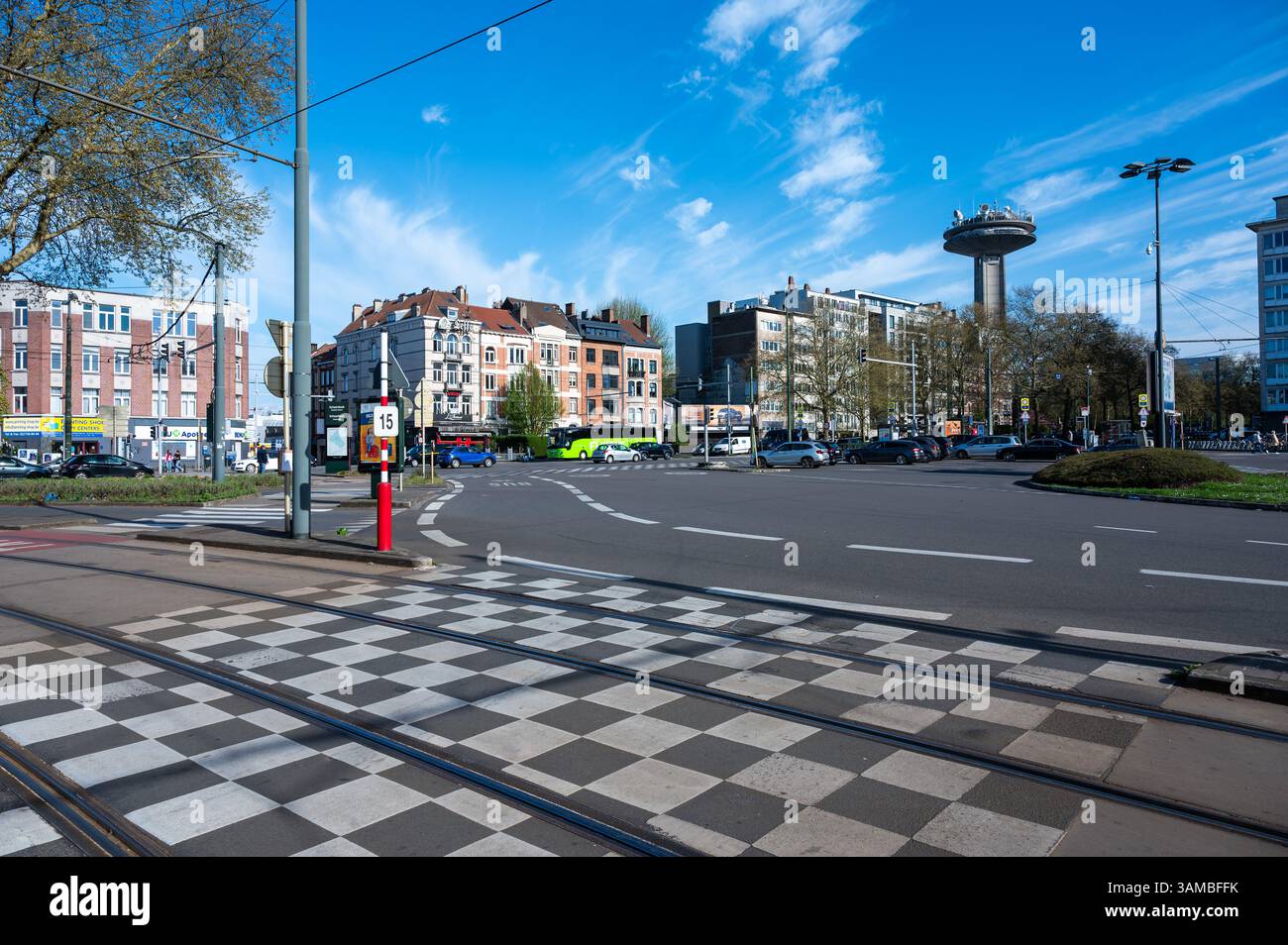 Traffic at the Place Meiser with the broadcasting VRT RTBF tower in the ...
