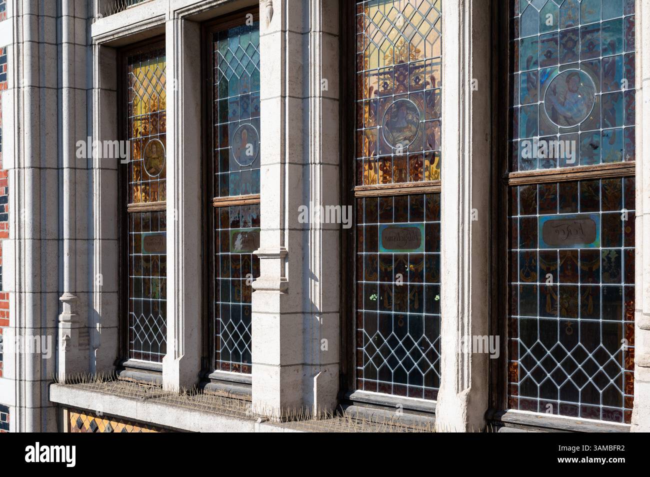 Decorated stained glass windows at the facade of the municipal hall of ...