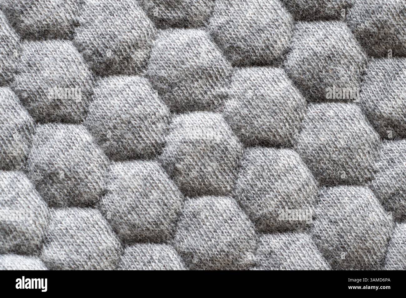 Closeup of gray fabric texture with hexagonal pattern for background Stock Photo
