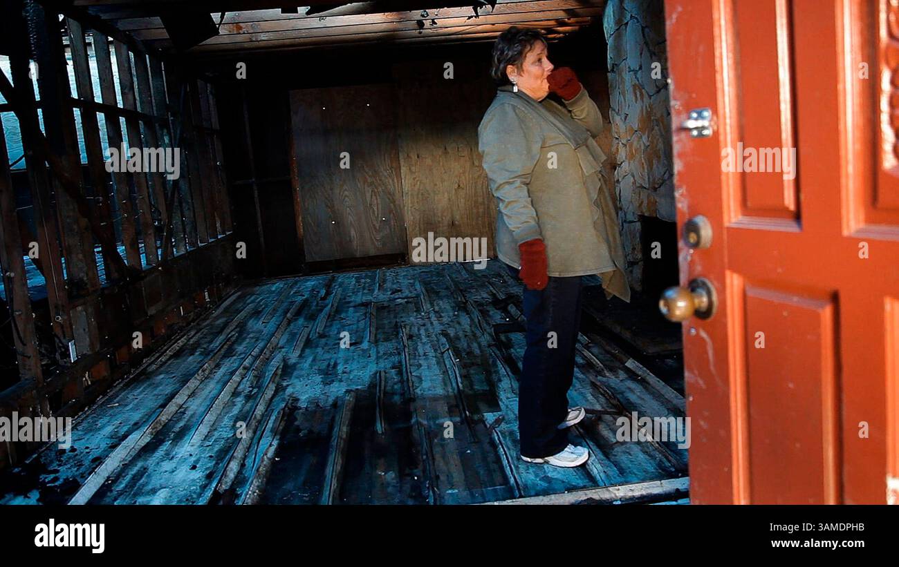 March 22, 2011 - San Bruno, CA, USA - Carlene Vasquez takes a last look around  before workers demolish the family home in San Bruno, California, on March 22, 2011. The home was damaged beyond repair in a natural gas pipeline explosion. The family plans on rebuilding. (Gary Reyes/San Jose Mercury News/MCT) (Credit Image: © Gary Reyes/MCT/ZUMAPRESS.com) Stock Photo