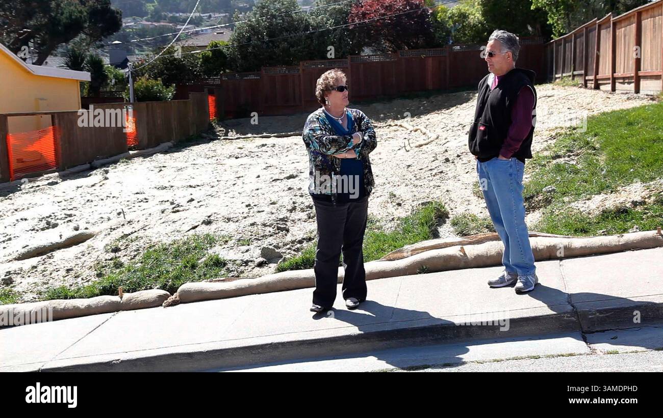 March 22, 2011 - San Bruno, CA, USA - Carlene andArt Vasquez stand at the empty lot after workers demolished the family home in San Bruno, California, on March 22, 2011. The home was damaged beyond repair in a natural gas pipeline explosion. The family plans on rebuilding. (Gary Reyes/San Jose Mercury News/MCT) (Credit Image: © Gary Reyes/MCT/ZUMAPRESS.com) Stock Photo