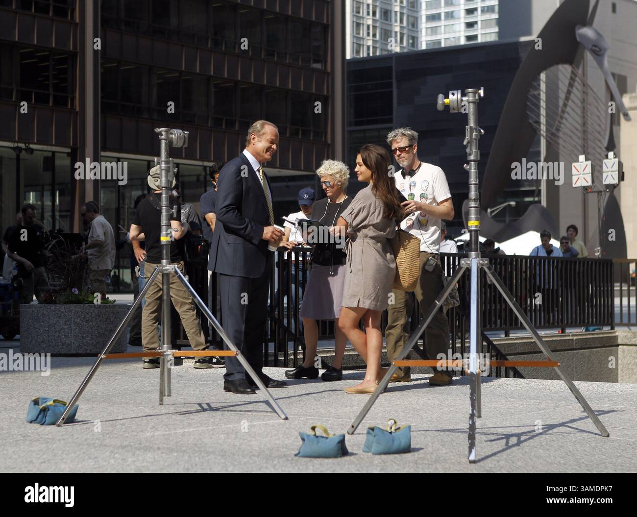 June 3, 2011 - Chicago, IL, USA - Kelsey Grammer, left, rehearses a scene with actress Hannah Wane, who plays his daughter (second from right) for the Starz TV show ''Boss'' in Daley Plaza in front of City Hall in Chicago, June 3, 2011. (Brian Cassella/Chicago Tribune/MCT) (Credit Image: © Brian Cassella/MCT/ZUMAPRESS.com) Stock Photo