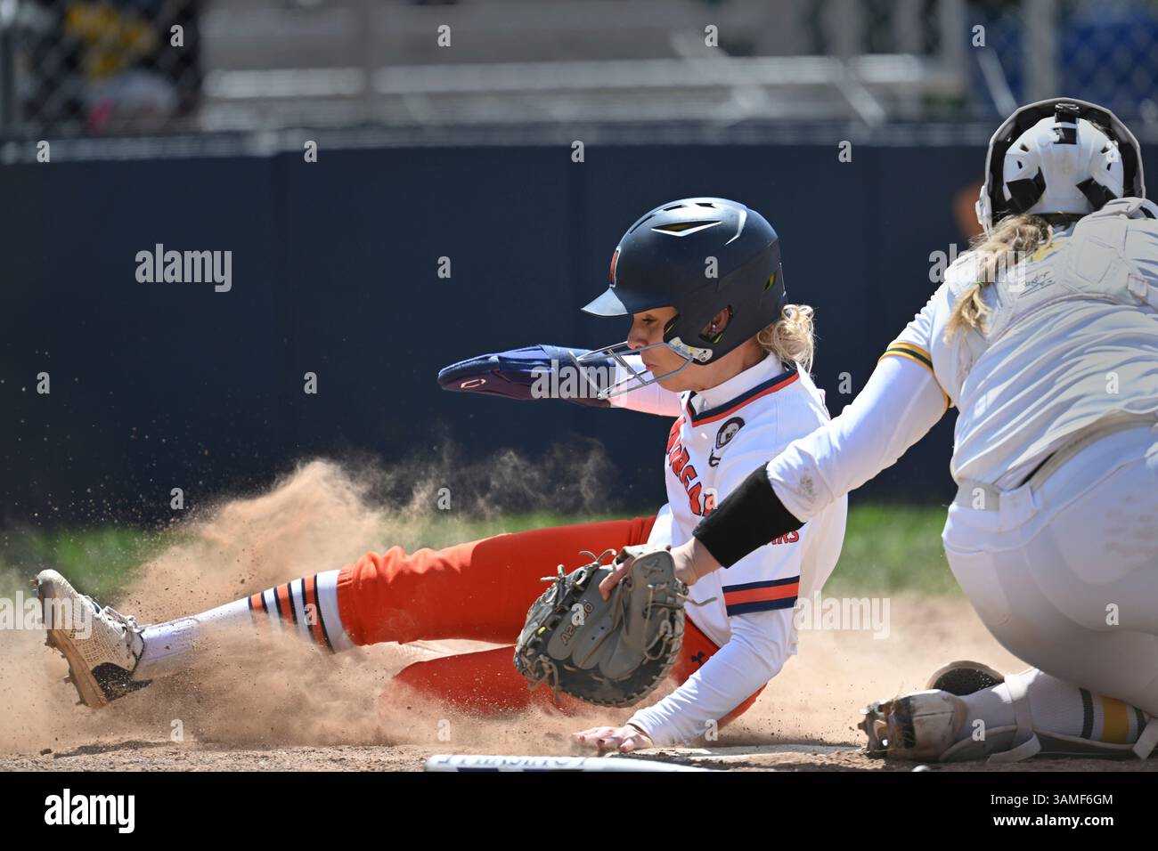 Morgan State's Millie Cousins is tagged as she slides past Norfolk ...