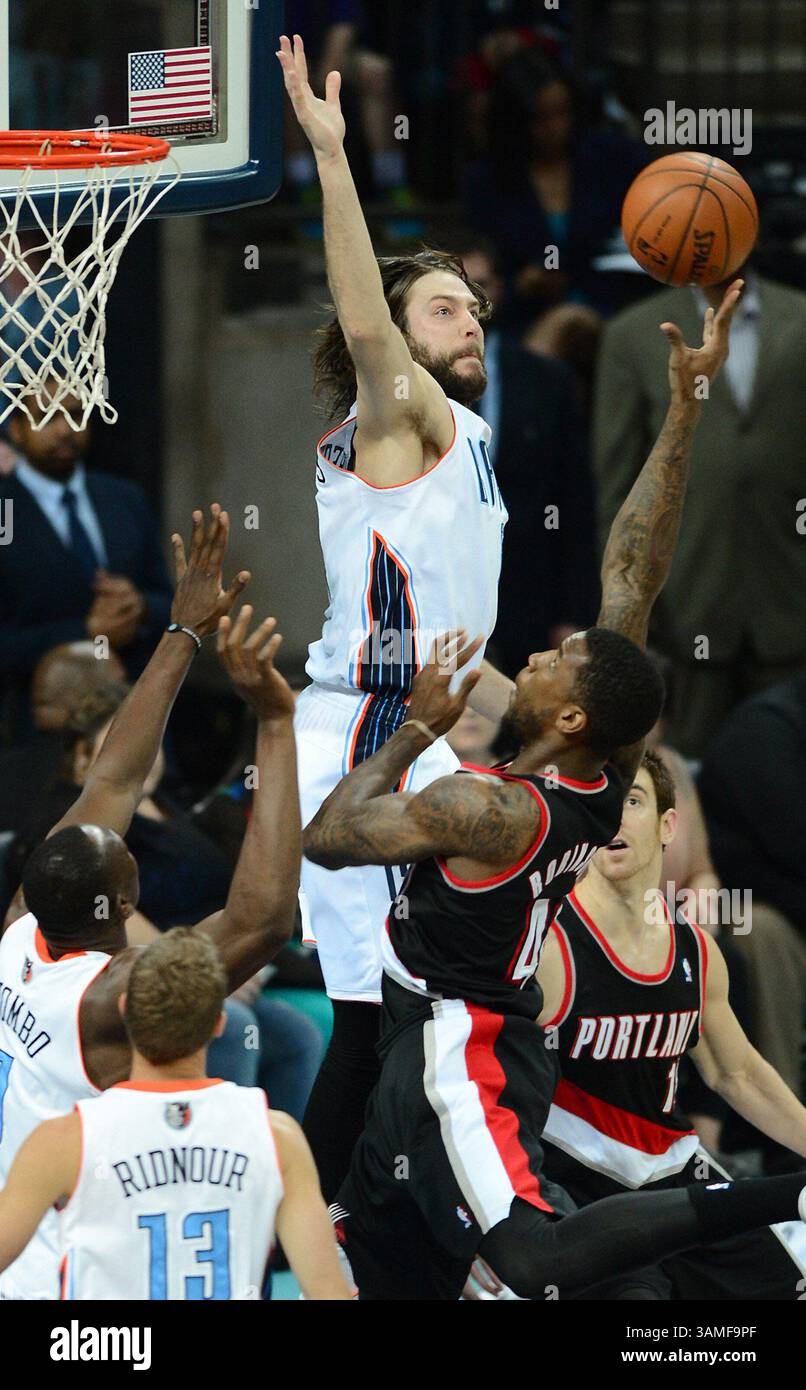Portland Trail Blazers' Thomas Robinson (41) dunks against Charlotte  Bobcats' Luke Ridnour (13) during the first half of an NBA basketball game  in Charlotte, N.C., Saturday, March 22, 2014. The Bobcats won, image size:806x1390