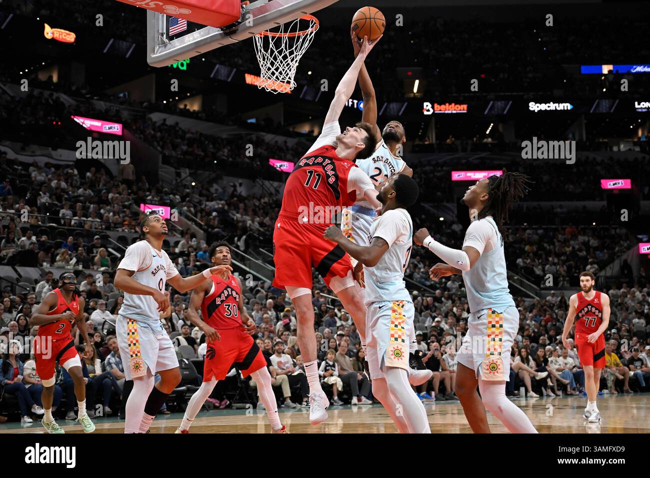 Toronto Raptors center Colin Castleton (11) reaches for a rebound ...