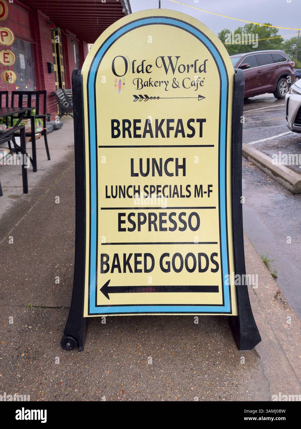 Sandwich board sign for the Olde World Bakery & Cafe in the small town of Smithville, Bastrop County, Texas, USA. - Smartphone Captured Stock Image