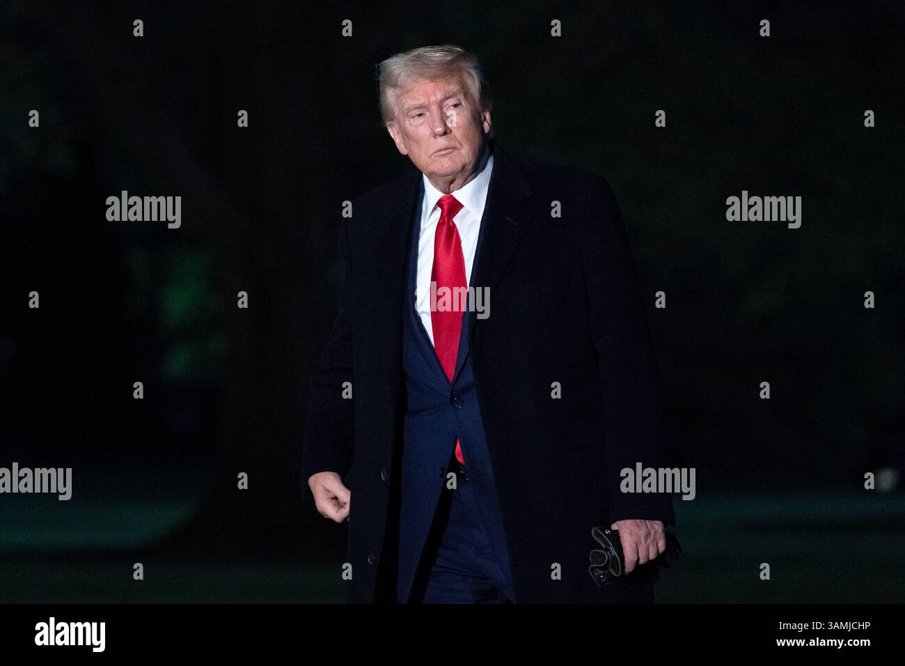 President Donald Trump walks on the South Lawn of the White House in ...