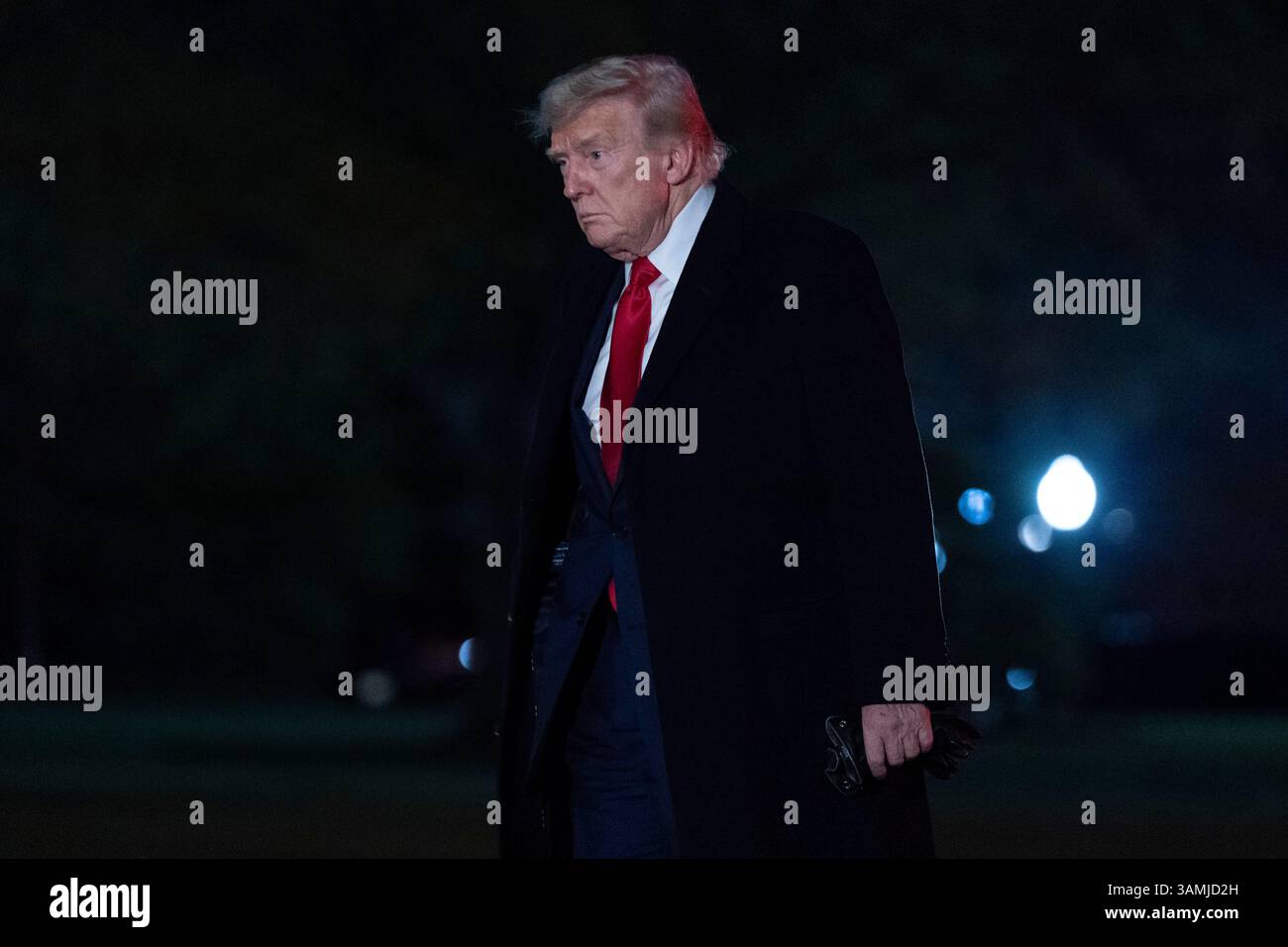 President Donald Trump walks on the South Lawn of the White House in ...
