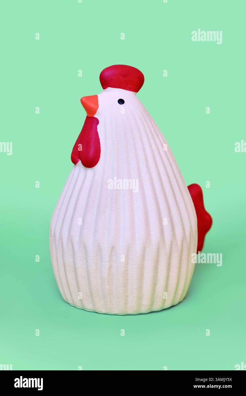 Chicken ceramic decoration object on mint green background Stock Photo