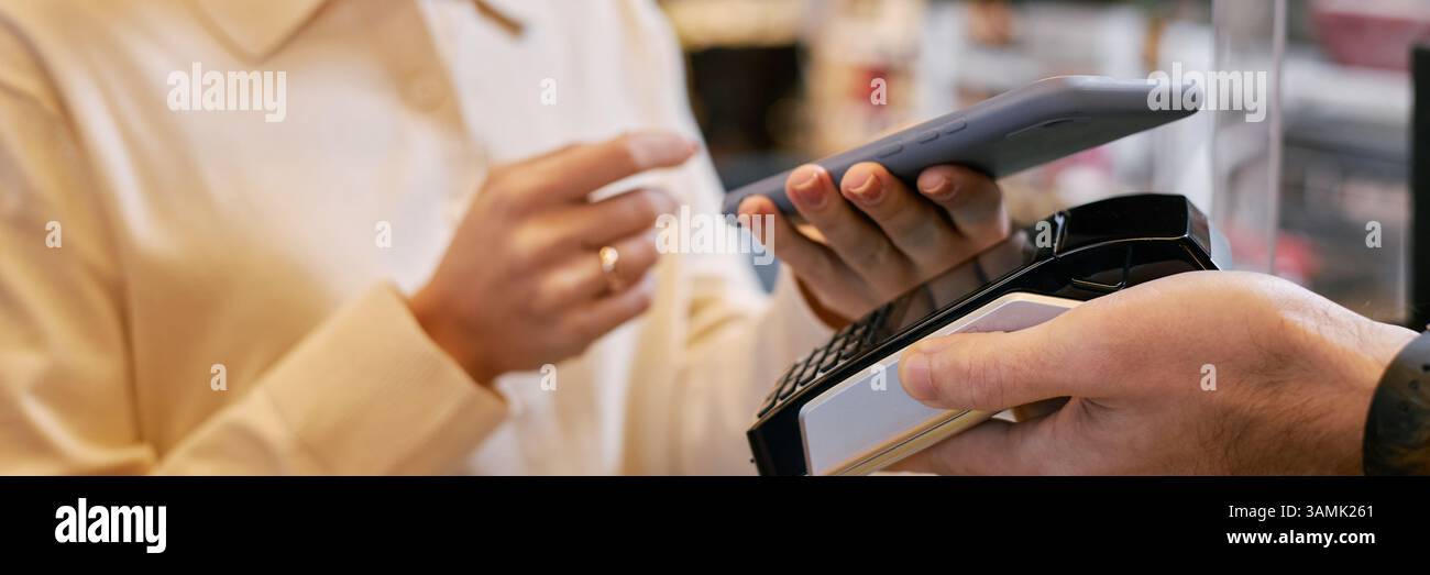 Terminal Customers Website header shot of customer holding smartphone while making mobile ...