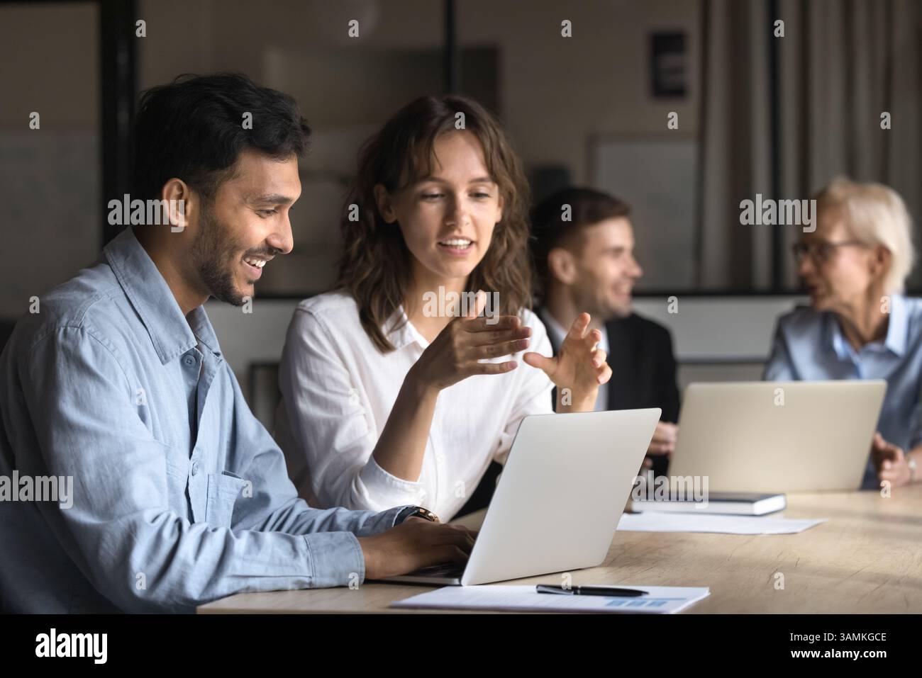 2 professional confident project managers collaborate Stock Photo