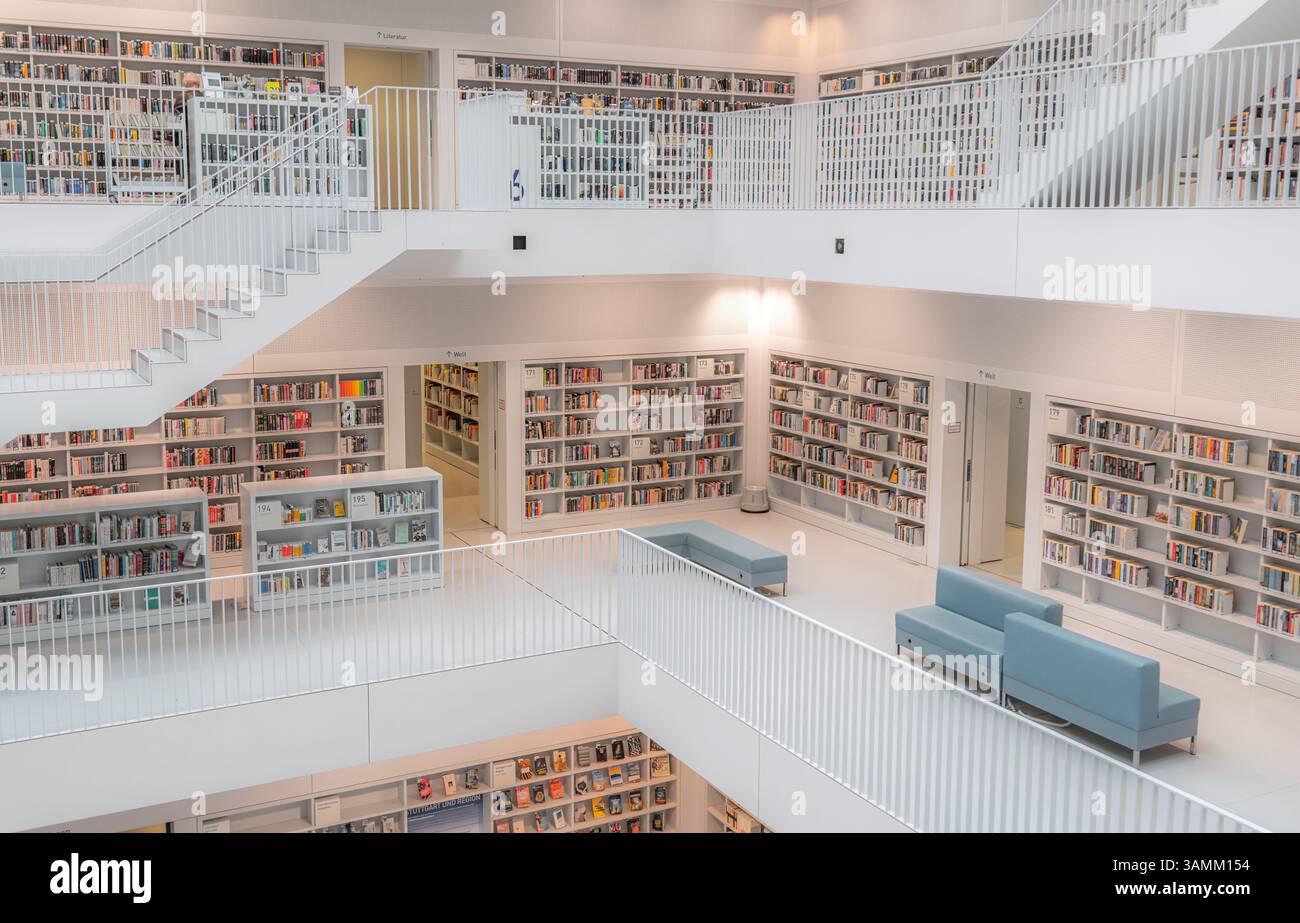 A contemporary library features elegant shelves filled with books ...