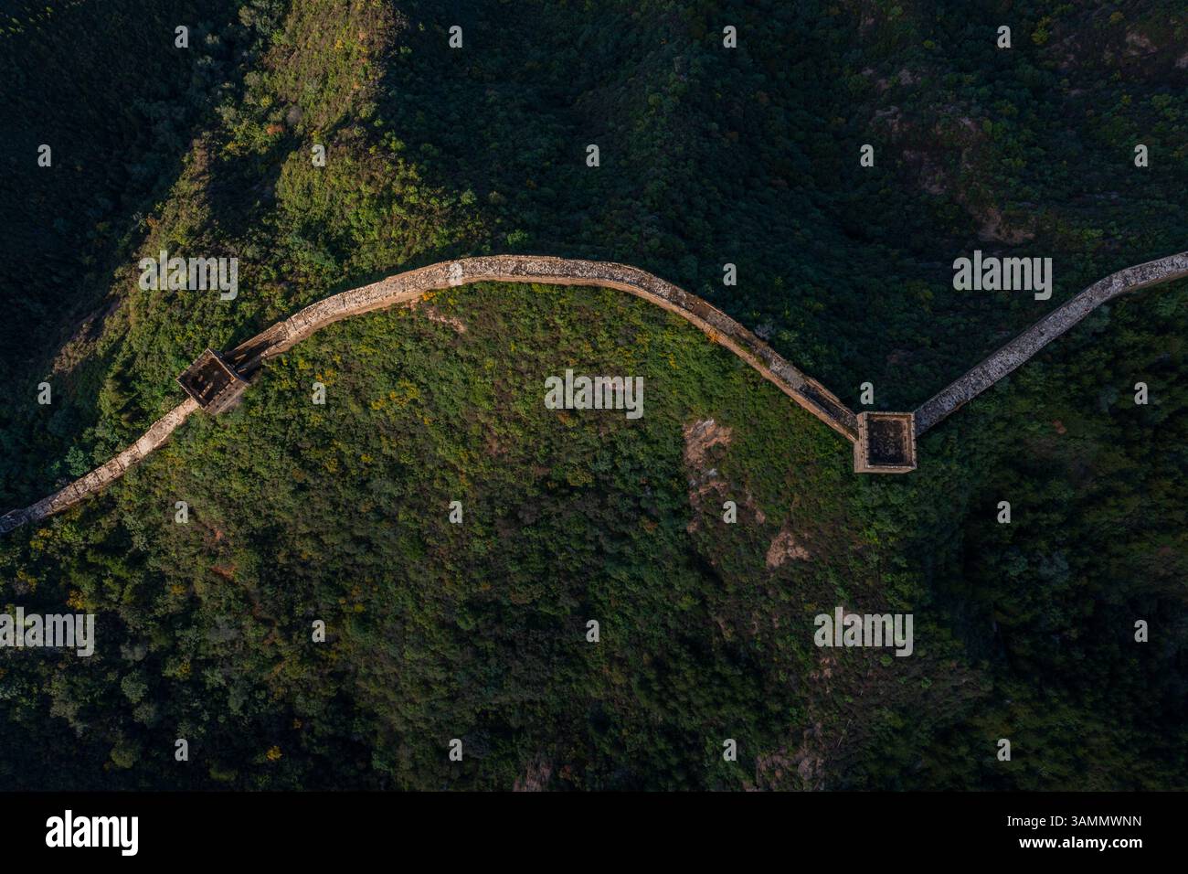 Aerial view of the majestic Jinshanling Great Wall surrounded by tranquil mountains and valleys, Chengde, China. Stock Photo