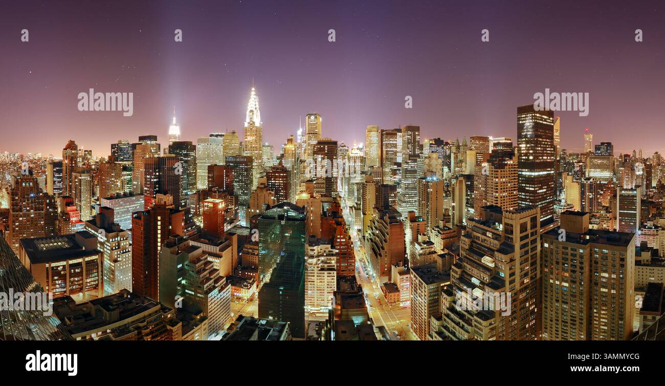 Aerial view of Manhattan at dusk with vibrant city lights and ...
