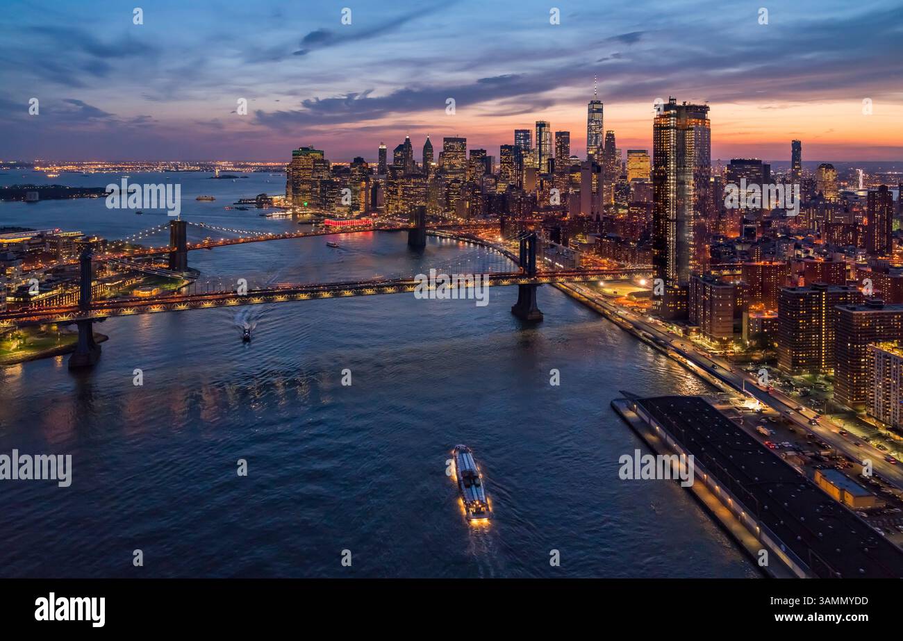 Aerial view of Manhattan skyline at sunset with East river, New York ...