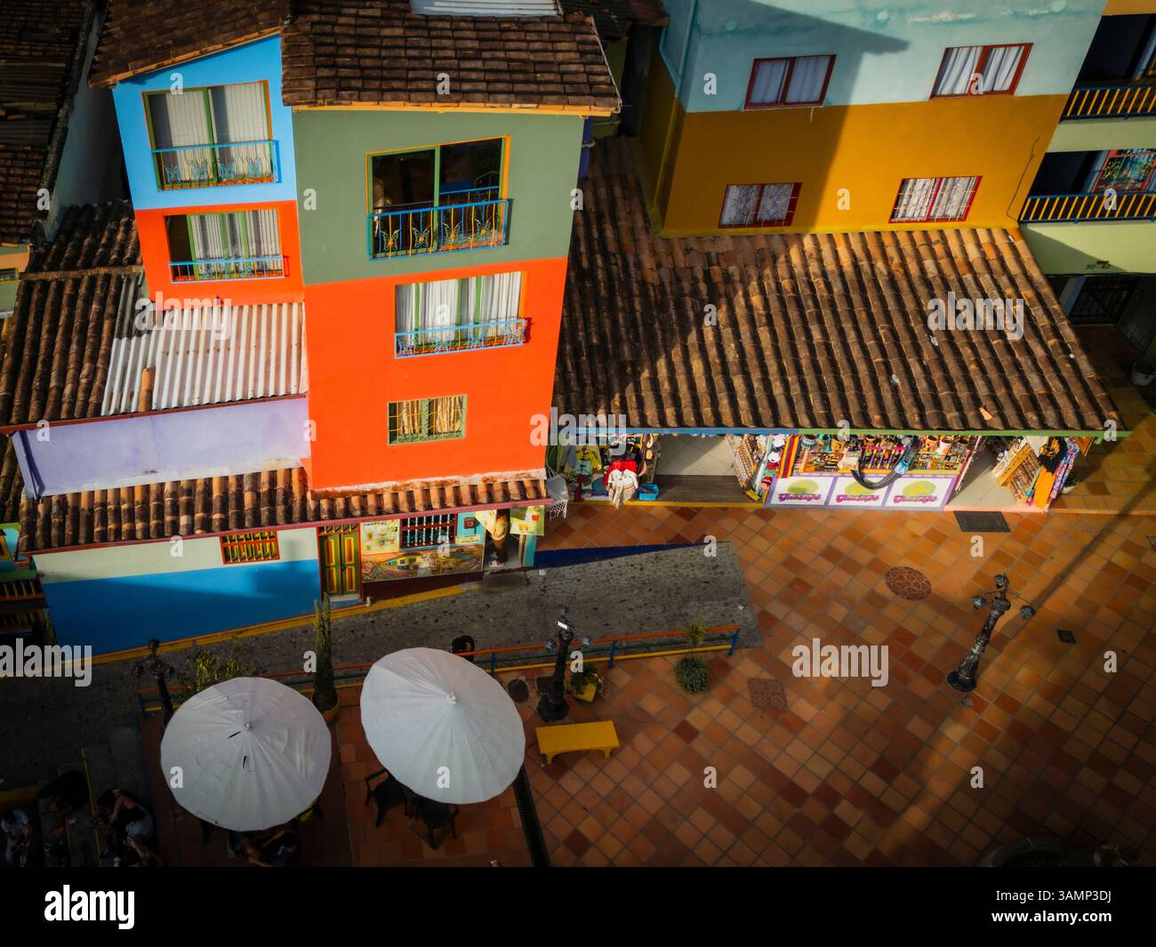 Aerial view of vibrant Guatape with colorful buildings and rooftops ...