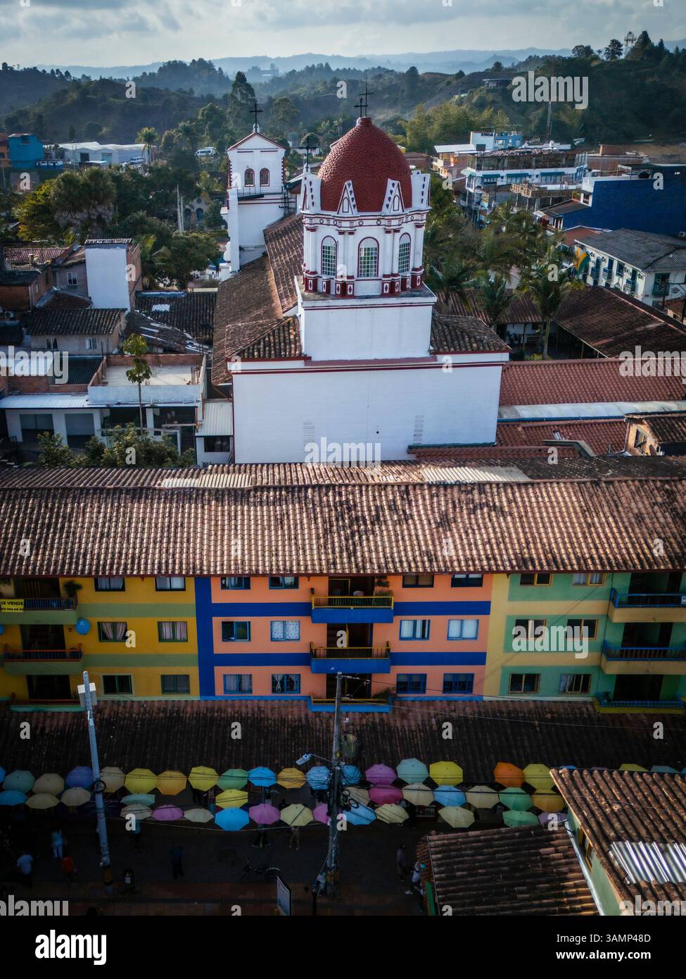 Aerial view of vibrant Guatape with colorful buildings, rooftops, and ...
