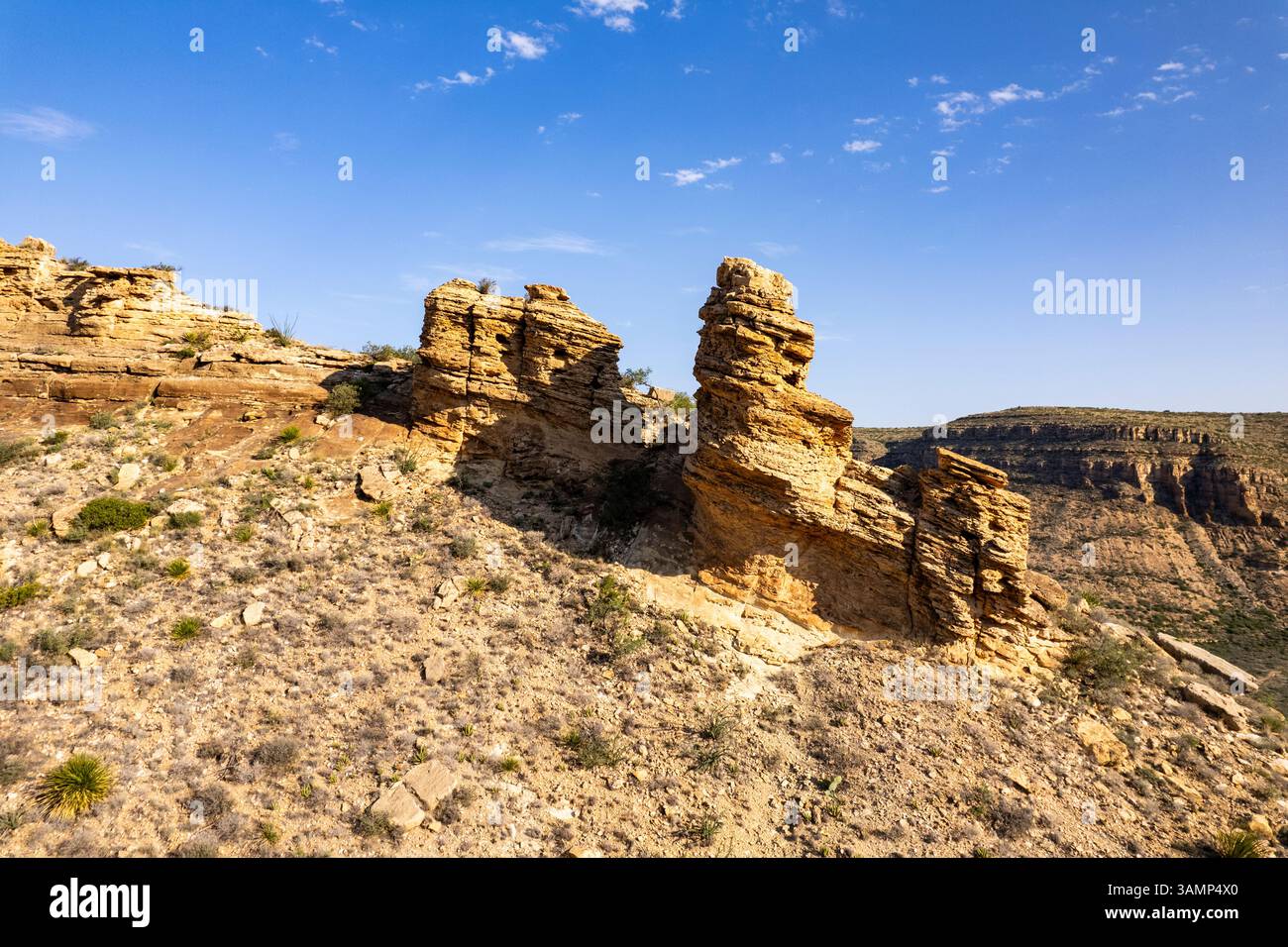 Aerial view of rugged rock formations and barren desert landscape in ...