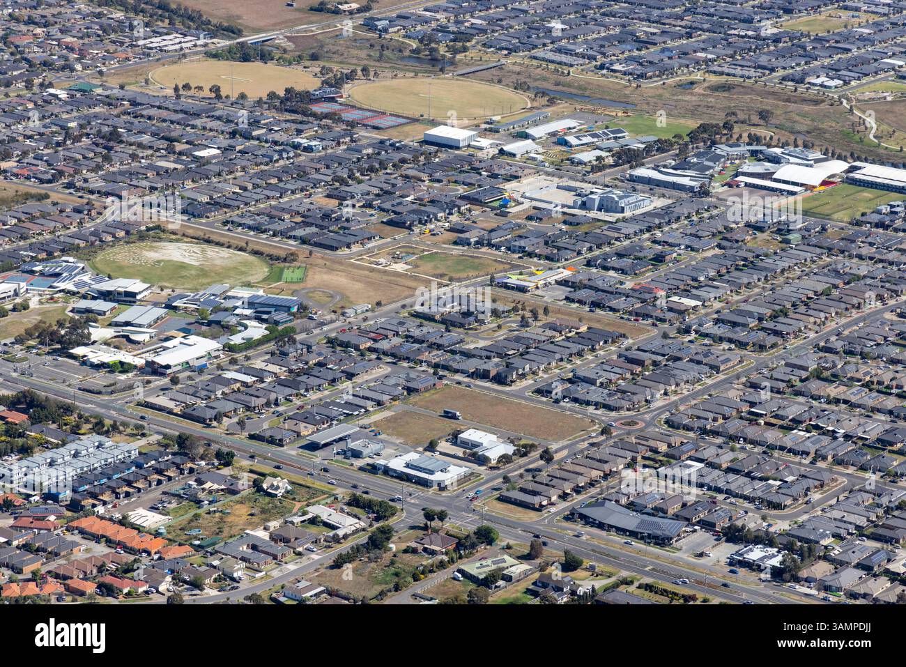 Aerial view of suburban houses and streets in a modern neighborhood ...